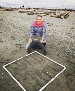 person sitting on sand