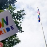 "UW Pride" sticker with flagpole in background