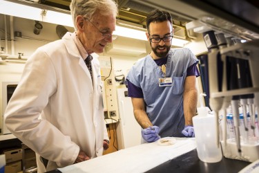 photo of pathologists preparing a slide