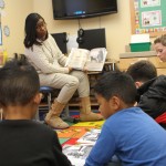 A new study by the University of Washington suggests schools need to partner with parents, rather than offer them limited volunteer roles. In this photo, parent volunteers read to a class of students.