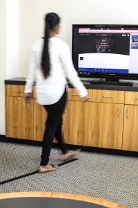 A person walking in a straight line.