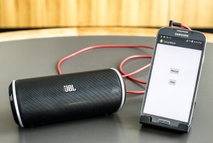 A smartphone and portable speaker