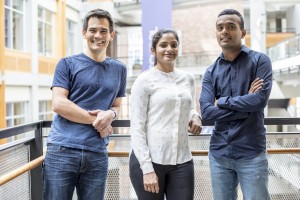 Three scientists standing together.