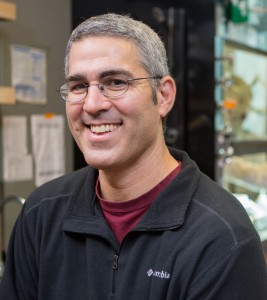 A man sitting in a lab.