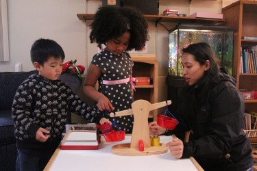 Children work with a teacher at an early learning facility that partners with Cultivate Learning (formerly the UW Childcare Quality & Early Learning Center for Research and Professional Development).