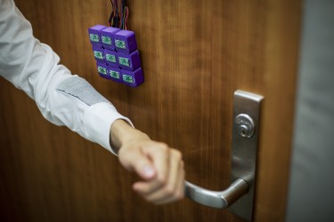 Using magnetic properties of conductive thread, University of Washington researchers are able to store data in fabric. In this example, the code to unlock a door is stored in a fabric patch and read by an array of magnetometers.