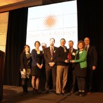 People posing at an award ceremony