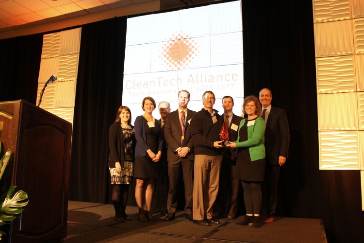 People posing at an award ceremony