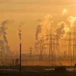 A picture of power lines at sunset. Everything is hazy.