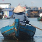 A women fishes in Tonle Sap Lake in Cambodia.