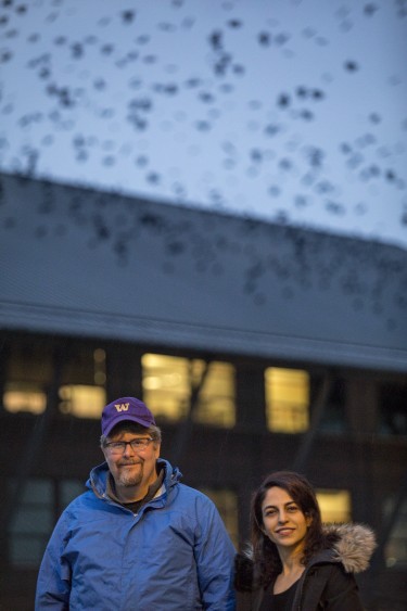 researchers in front of building