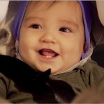 A 7-month-old baby sits in the Magnetoencephalography machine at the UW Institute for Learning & Brain Sciences. An I-LABS study shows how babies' brains register "felt touch" and "observed touch."