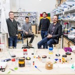 four people in a laboratory