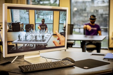 The UW Reality Lab will focus on developing next-generation virtual and augmented reality technologies and educating an industry workforce. In this holographic chess game developed by UW students, opponents move pieces that can only be seen through a virtual reality headset.