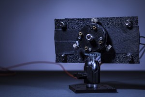 The UW team's prototype laser emitter. The high-powered guard beam is emitted from the central port. Four low-powered guard beams are emitted from ports surrounding the guard beam. Next to each guard beam port are clear photodiodes, which detect the guard beams when they're reflected back to the emitter by retroreflectors on the phone.