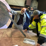 Woody Sullivan, UW professor emeritus of astronomy, consults with Larry Tate, principal at Seattle's Fabrication Specialties Ltd., right, on the necessary angle and placement of a new gnomon to ensure the time-keeping accuracy of Olympia's Territorial Sundial.