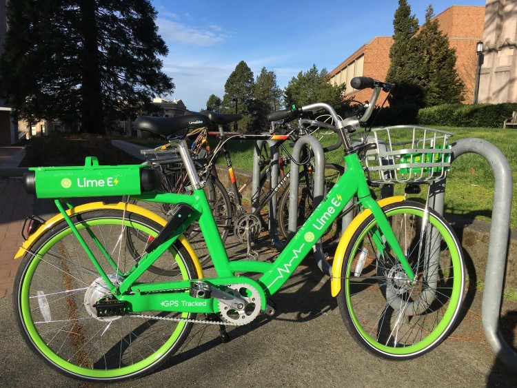 Green bike parked in a bike rack