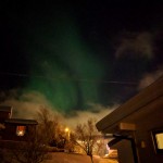 green bands of lights in dark sky
