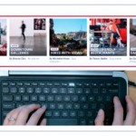 fingers above keyboard with computer screen above