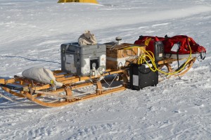 wooden sled loaded with instruments