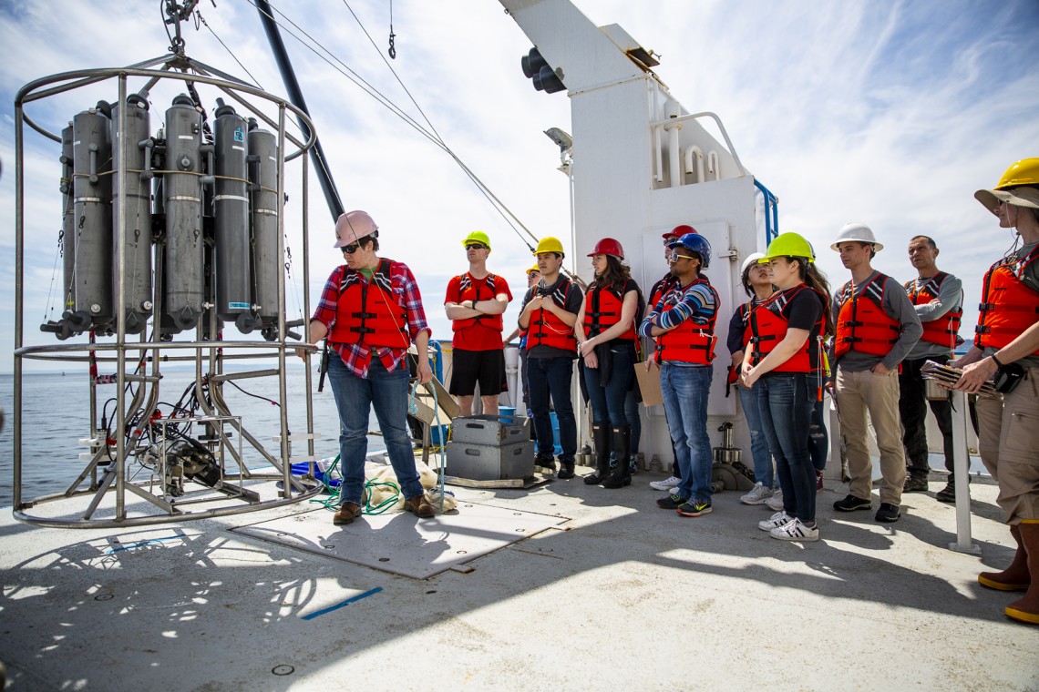 students standing in line on deck