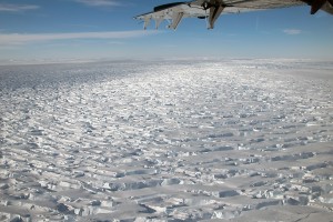 ridged ice with airplane wing in foreground