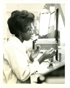 A woman making a core memory object