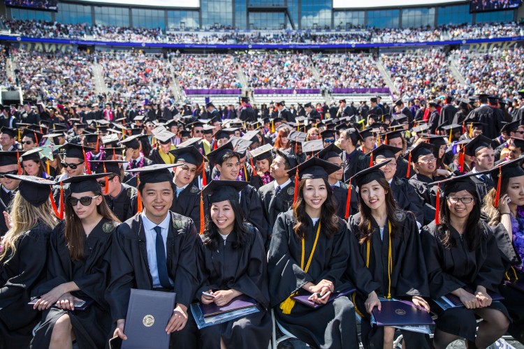 Graduates and their families and friends attend the UW's 142nd Annual Commencement Ceremony at the Husky Stadium.