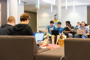 Scientists working together on computer projects.
