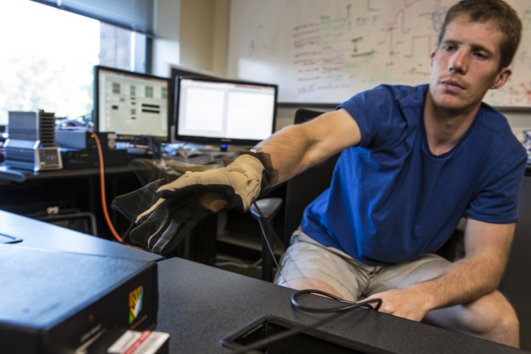 testing the hardware used for stimulating and recording a patient’s brain surface, including a "cyber glove"