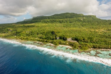 Rota is the southernmost island of the Northern Mariana Islands and is home to the Aga Recovery Project. Photo of island coastline.