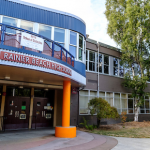 Rainier Beach High School in Southeast Seattle was proposed for closure in 2008, but community members rallied around a new vision for the school. Photo of front of school building.