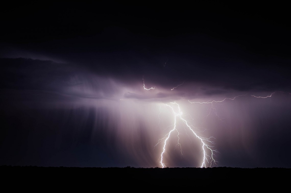 Flash of lightning on black background