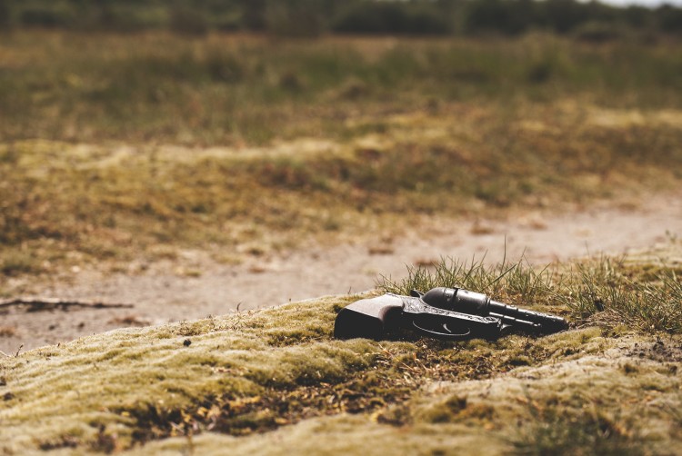 A study led by the University of Washington shows that public perception of gun violence and homicide risk is far from the reality of the data. Photo of firearm lying on the ground.