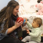 Talking to a baby in "parentese," with its elongated vowels and exaggerated tones of voice, can improve the infant's language skills over time, according to a new University of Washington study. Photo of mother looking and talking to her baby.