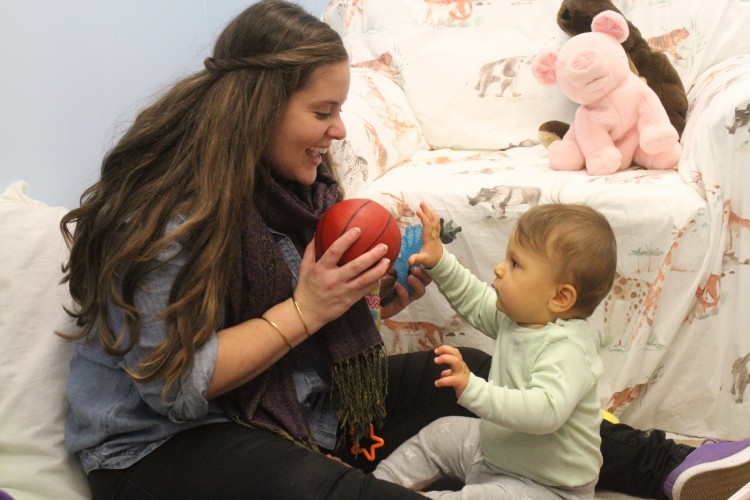 Talking to a baby in "parentese," with its elongated vowels and exaggerated tones of voice, can improve the infant's language skills over time, according to a new University of Washington study. Photo of mother looking and talking to her baby.