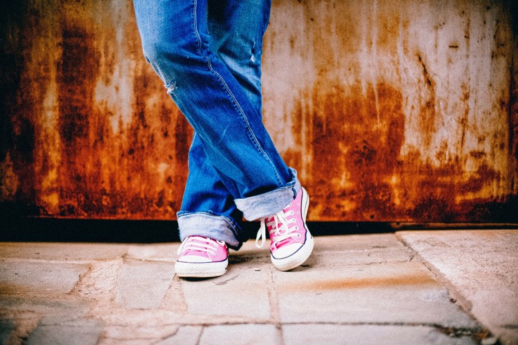 A study led by the University of Washington finds that children who are exposed to violence tend to age faster. Photo of teenager's feet.