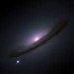 An image of a galaxy in outer space, with a bright supernova visible at its outer edge.
