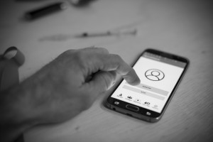 A person starts Second Chance's monitoring function