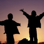 A University of Washington-led study finds that children who socially transition to the gender "opposite" their sex at birth also demonstrate strong "cross-gender" identities before the transition. Photo of two children in silhouette.