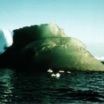 green iceberg on blue background