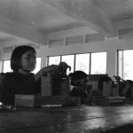 This is one of dozens of photographs of Cambodian citizens, taken by journalist and UW alum Elizabeth Becker on her tour of the country in 1978. Photo of young girl in a factory