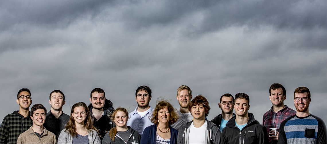 group of people against cloudy sky