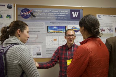 people in front of poster