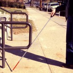 People who are visually impaired rely on other senses to interpret their surroundings. A pair of studies from the University of Washington shows how the brains of blind people adapt to process information. Photo of blind person walking with cane.