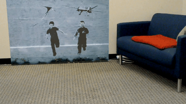 A graffiti child runs off the wall and into a room with augmented reality