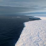 white snow and ocean
