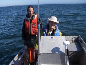 Two people in a boat in Willapa Bay in Washington state.