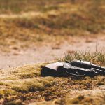 Gun in field grass