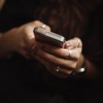 Woman holding a smart phone